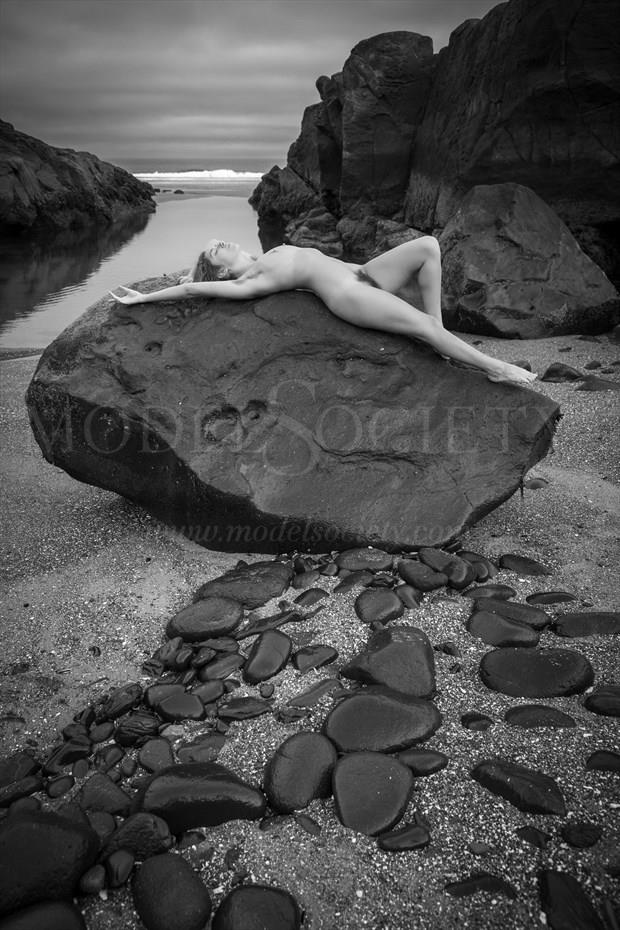Black Rock Reclined Artistic Nude Photo by Photographer Inge Johnsson