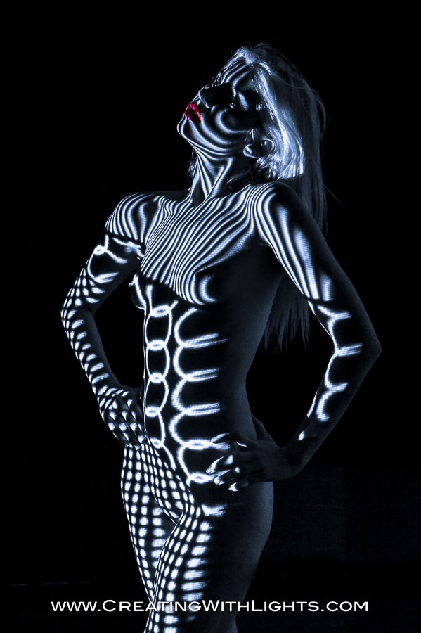 Blue light Implied Nude Artwork by Artist Creating With Lights