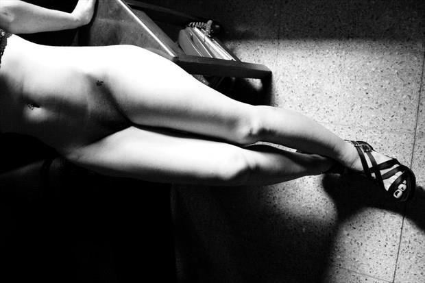 a woman waits in her chair by amilcar in erotica de la cultura buenos aires naked rest artistic nude artwork by photographer amilcar moretti