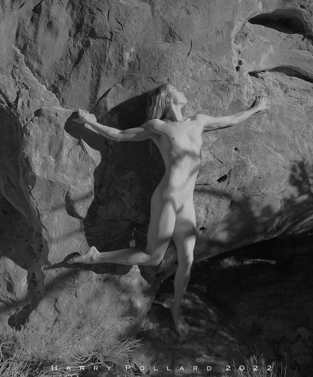 against a rock artistic nude photo by photographer shootist