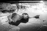 and the river is flowing like glass artistic nude photo by photographer robert koudijs