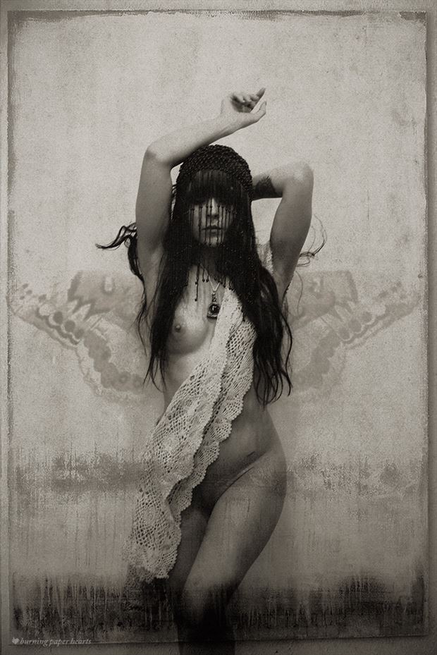 artistic nude vintage style artwork by photographer burning paper hearts