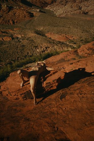 basking on the red rocks artistic nude photo by model phenix raynn