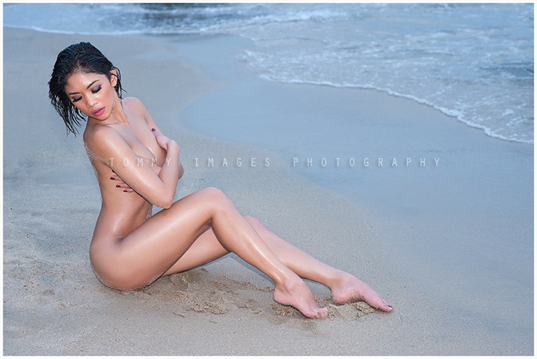 beach shot implied nude photo by photographer tommy images