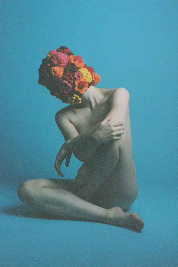 contemplative flower head artistic nude photo by model ahna green