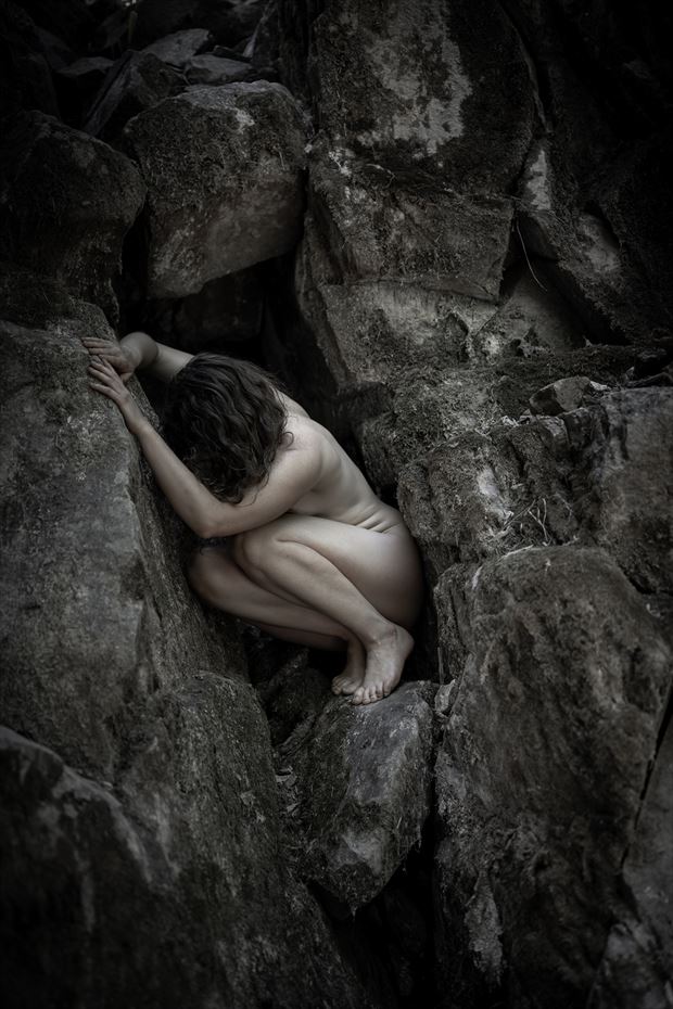 crouched in the rock artistic nude artwork by model jessa ray muse