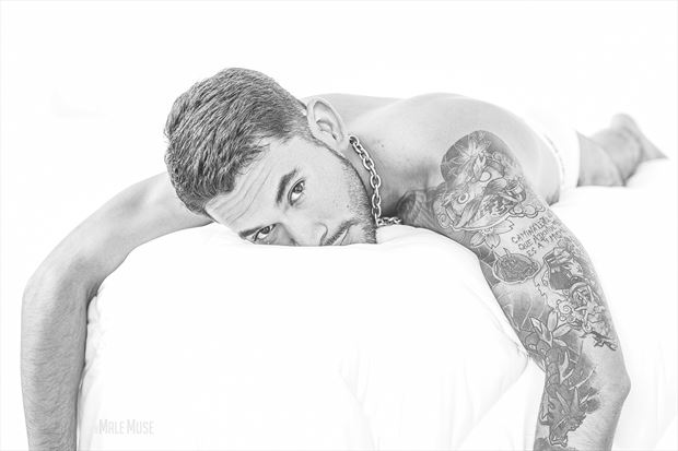 enrique relaxing in bed tattoos photo by photographer the male muse