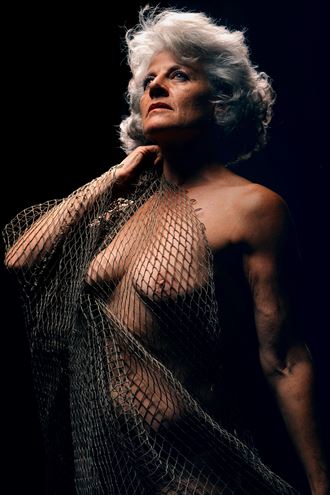 fishnet with light above sensual photo by model lavivie1969