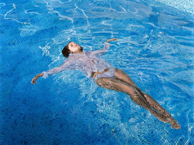 floating in blue bikini artwork by artist johannes wessmark
