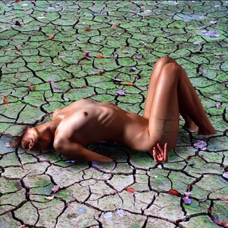 half buried in dried mud artistic nude artwork by photographer yoga chang