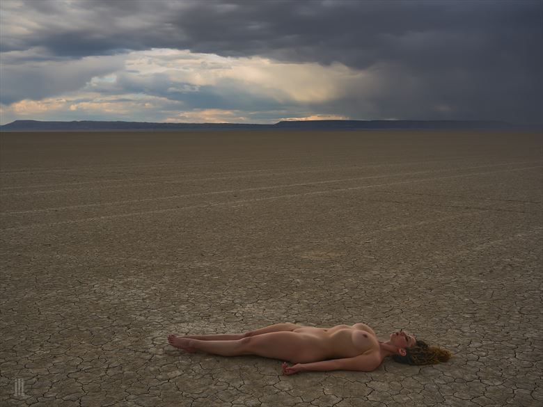 her stillness dances on the playa artistic nude photo by photographer james landon johnson