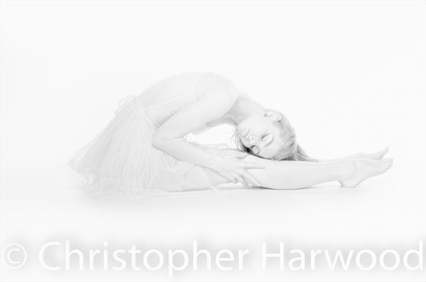 high key portrait of a ballerina stretching surreal photo by photographer christopher harwood