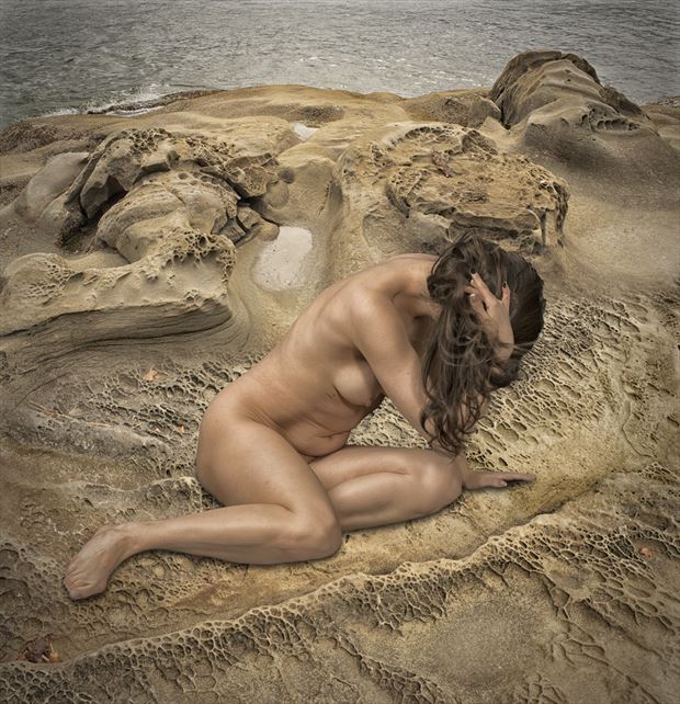 idyllic on the rocks artistic nude photo by photographer tom gore