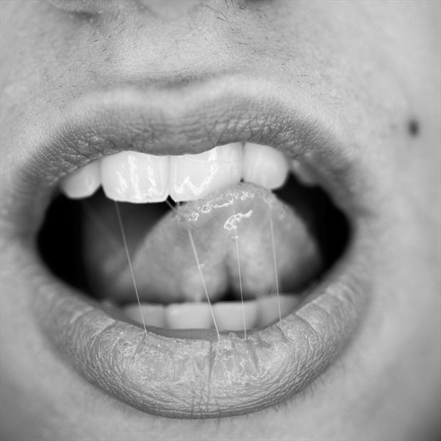 imprisoned tongue sensual photo by photographer ugrandolini