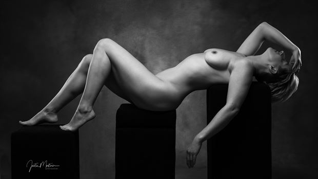 lying down artistic nude artwork by photographer justin mortimer
