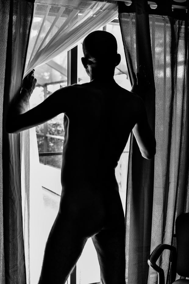 man in the window artistic nude photo by photographer michael mcintosh