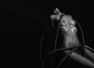 metal tube meets naked skin artistic nude photo by photographer christian schmidt