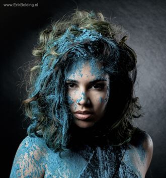 model covered in blue powder surreal photo by photographer erik bolding