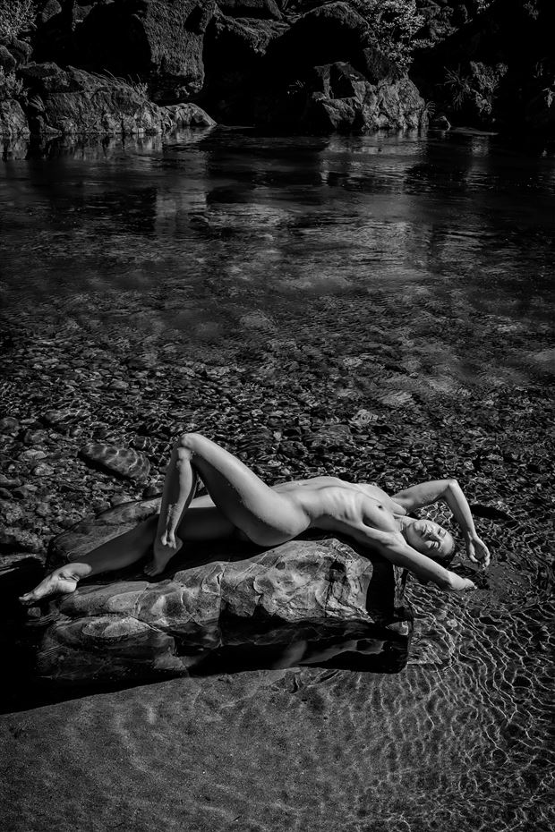 nude on river rocks artistic nude photo by photographer philip turner
