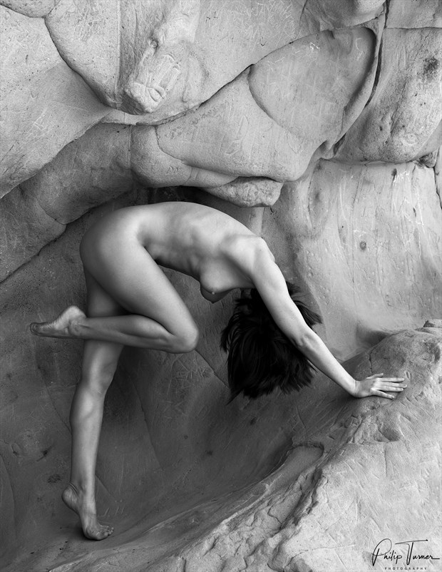 recurve in the rocks artistic nude photo by photographer philip turner