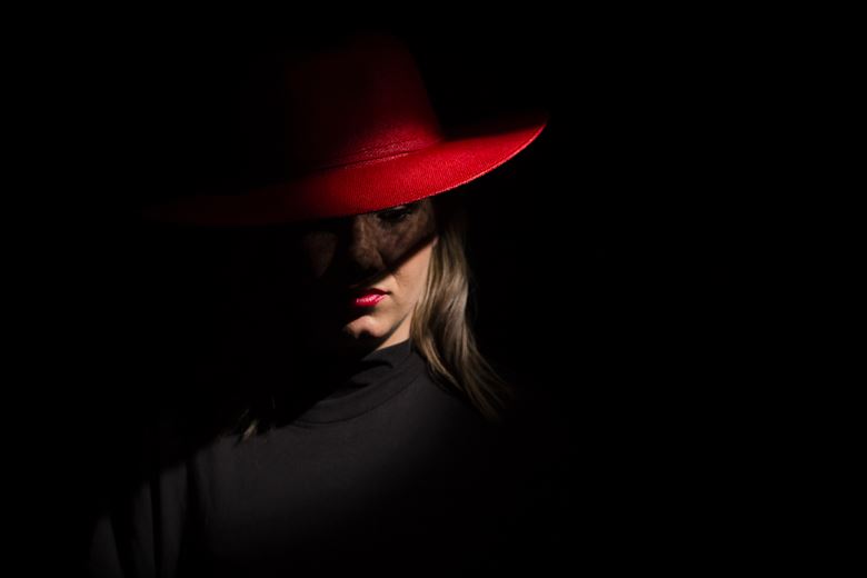 red hat and lipstick chiaroscuro photo by photographer andre