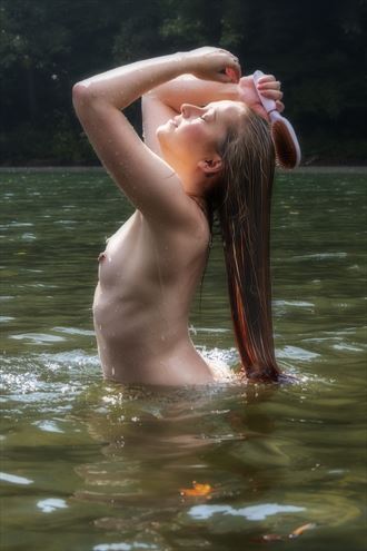 red head model brushing her hair in the water artistic nude photo by photographer daniel l friend
