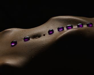 resting stones artistic nude photo by photographer john dunkelberg