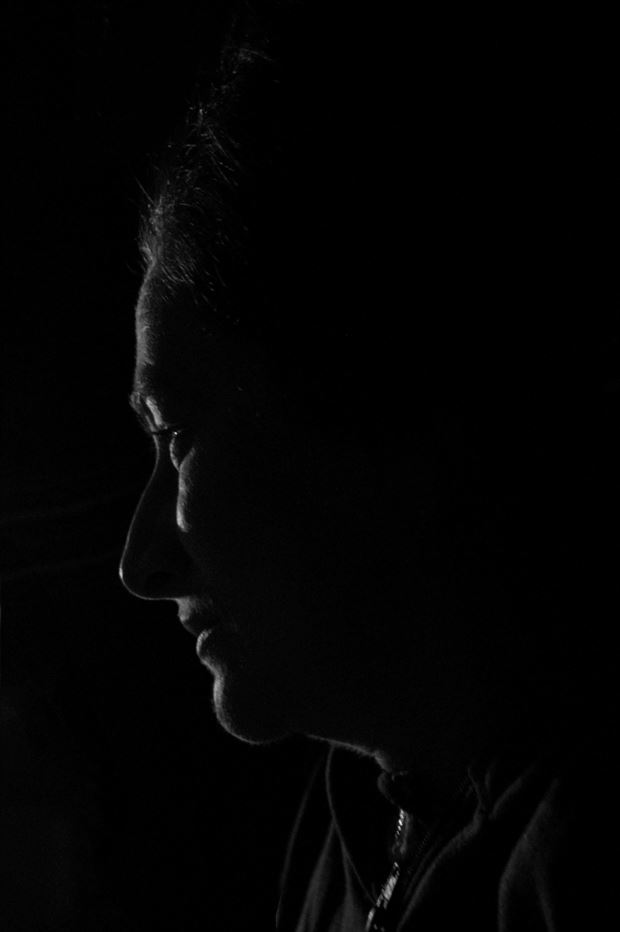 sadness in the dark silhouette photo by artist julian monge najera