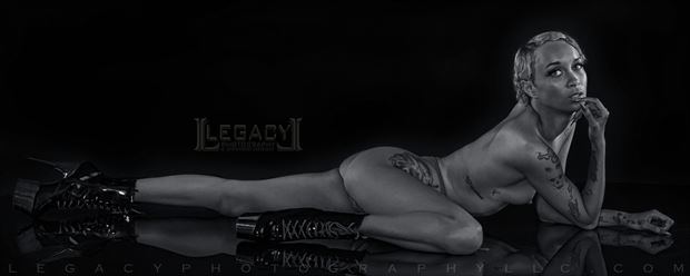 sensual stretch in black and white artistic nude photo by photographer legacyphotographyllc