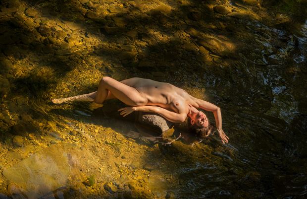supine in the creek artistic nude artwork by photographer ian harris