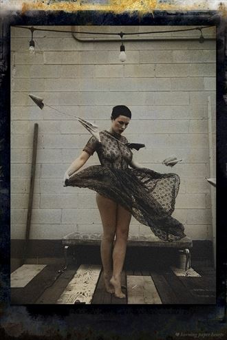 vintage style sensual photo by photographer burning paper hearts