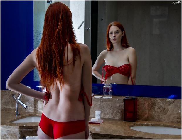 would her boss like to see here with or without the little red bra she pondered lingerie photo by photographer glyn davies spain