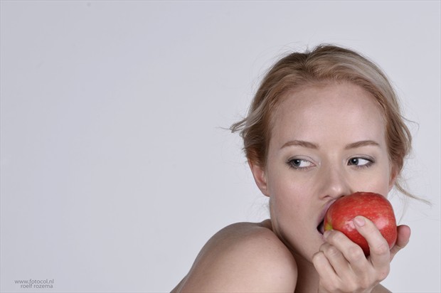 Gabriella with Pink Lady apple Close Up Photo print by Photographer Roelf Rozema Fotocol