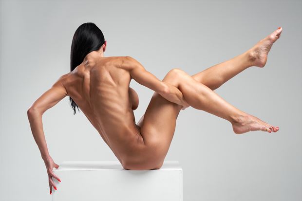 lady posing on the cube erotic photo print by photographer oleg kamikaze