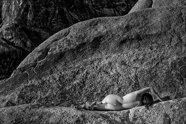 nude on a ledge artistic nude photo print by photographer philip turner