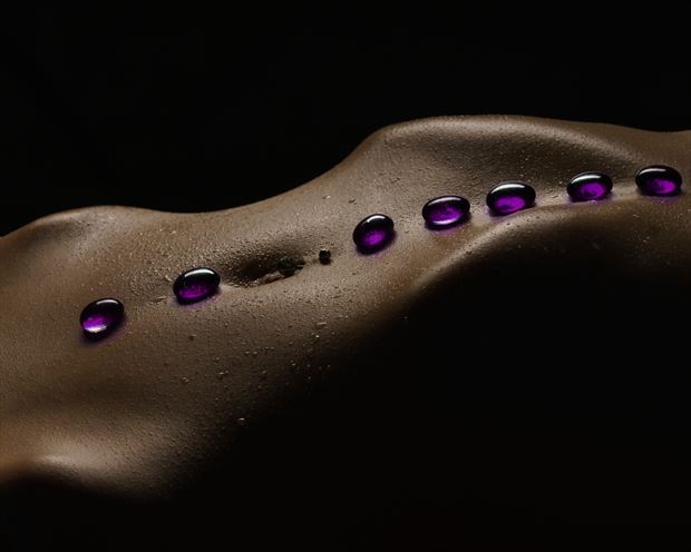 resting stones artistic nude photo print by photographer john dunkelberg