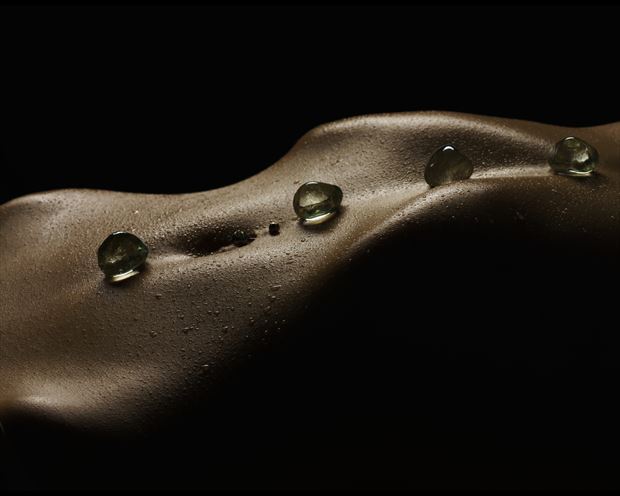 stones on waves artistic nude photo print by photographer john dunkelberg