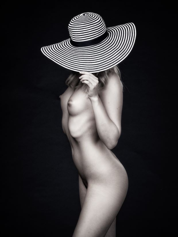 under her hat artistic nude photo print by photographer paul mason